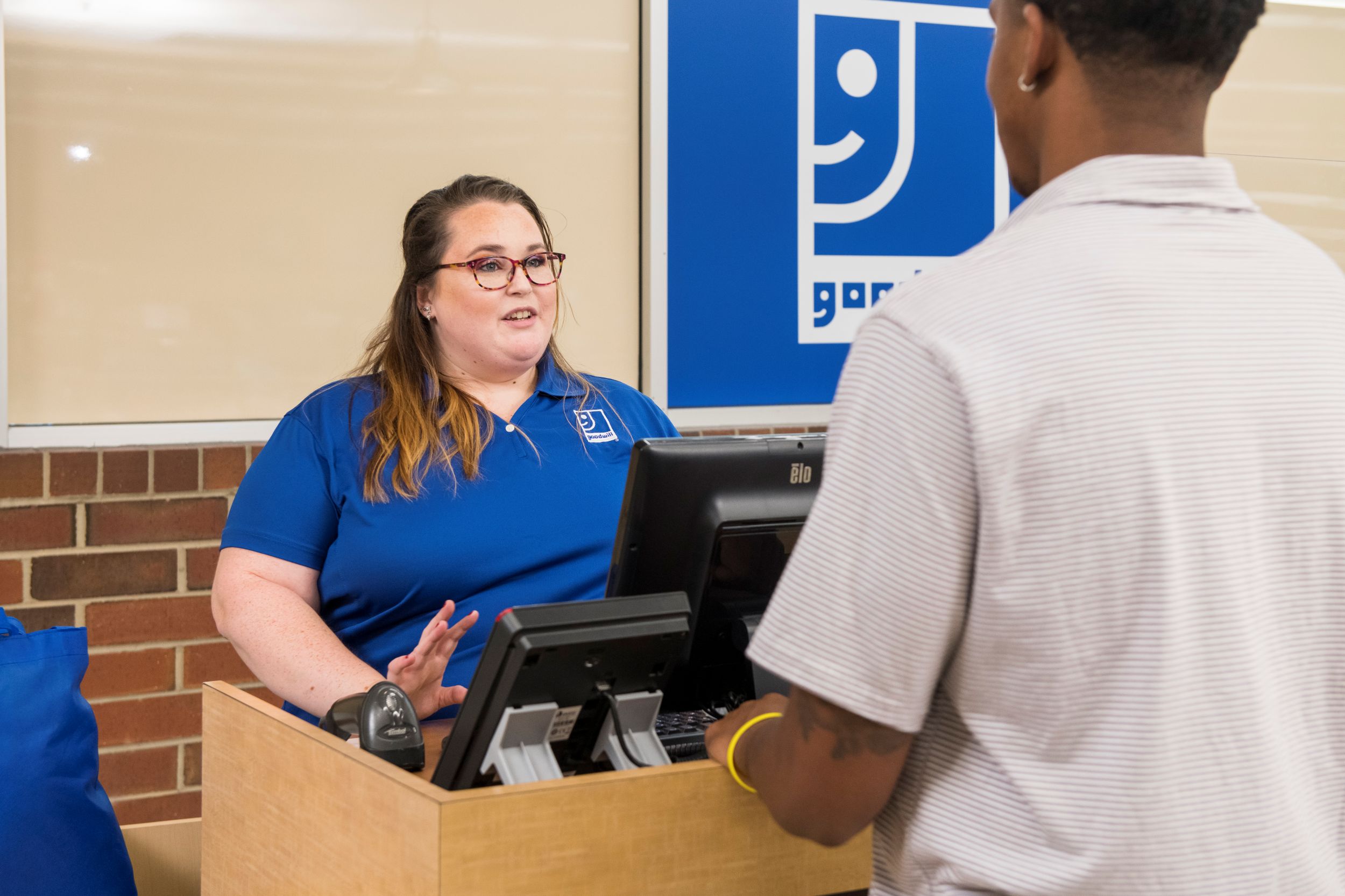 A volunteer helping with Evansville Goodwill activities